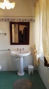 a bathroom with a sink and a mirror at Sant'Antonio in Volterra