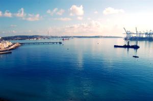 a view of a large body of water with a dock at Water's Edge Hotel in Birżebbuġa