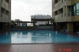 a large swimming pool in the middle of a building at 67 sqm. Condo Unit in Robinson Place Residences in Manila