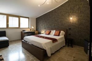a bedroom with a large bed in a room at B&B San Carlo in Lamezia Terme