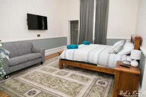 מיטה או מיטות בחדר ב-The Convent Boutique Accommodation