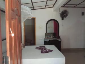 Voodi või voodid majutusasutuse Sigiriya River Side Resort toas