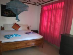 Voodi või voodid majutusasutuse Sigiriya River Side Resort toas