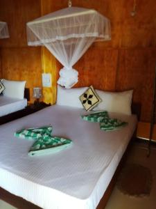 Voodi või voodid majutusasutuse Sigiriya River Side Resort toas