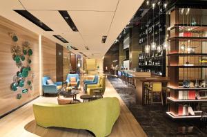Area soggiorno di Hampton By Hilton Foshan Sanshui
