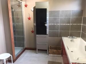 a bathroom with a shower and a sink and a tub at le Sunset Loft 88 maison neuve et moderne in Sainte-Adresse +26 photos