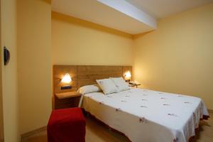 Postel nebo postele na pokoji v ubytování Hotel Restaurante Pontiñas