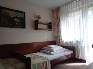 Letto o letti in una camera di OW Inter Piast Kalbornia - z własną plażą z kąpieliskiem i przystanią
