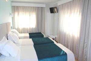 Postel nebo postele na pokoji v ubytování Hotel D. Dinis