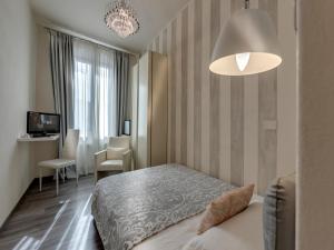 Postel nebo postele na pokoji v ubytování Hotel Palagi