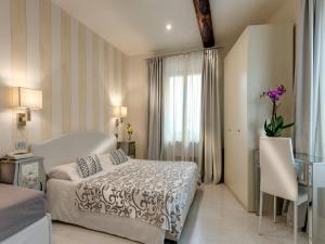 Postel nebo postele na pokoji v ubytování Hotel Palagi
