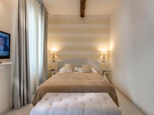 Postel nebo postele na pokoji v ubytování Hotel Palagi