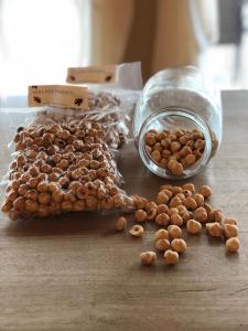 a pile of chickpeas next to a jar of nuts at B&B La Quercia in Moncalvo +84 photos