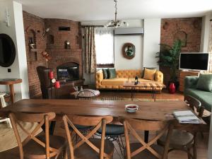 a living room with a table and a couch at Villa Özdilek in Sapanca