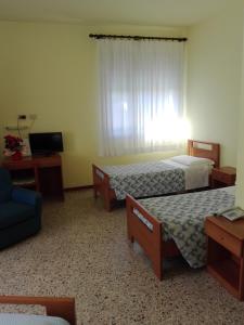 Postel nebo postele na pokoji v ubytování Hotel Senio