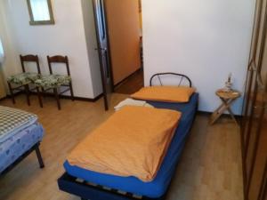 Postel nebo postele na pokoji v ubytování Casa Lily