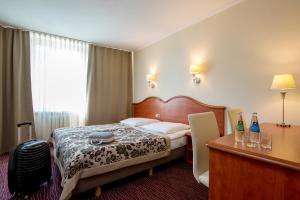 Posteľ alebo postele v izbe v ubytovaní Hotel Krakus