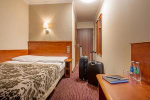 Posteľ alebo postele v izbe v ubytovaní Hotel Krakus