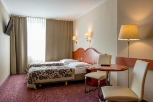 Posteľ alebo postele v izbe v ubytovaní Hotel Krakus