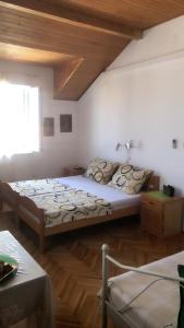 a bedroom with two beds in a room at Apartment Vesna in Supetar