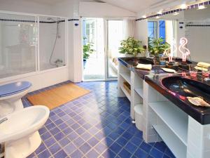 a bathroom with two sinks and a toilet at Villa in France near Beach & Private Pool in Anglet +32 photos