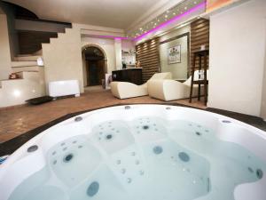 a jacuzzi tub in the middle of a living room at Farmhouse in Lazio with Lake Bolsena Views in Montefiascone +32 photos