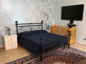 Katil atau katil-katil dalam bilik di Casa di San Martino