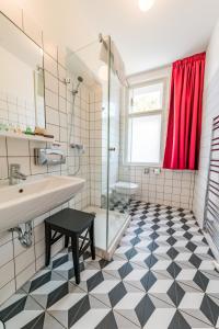 a bathroom with a shower and a sink and a toilet at Boutique hotel Villa Beatika in Český Krumlov