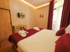 Postel nebo postele na pokoji v ubytování La'Rooms