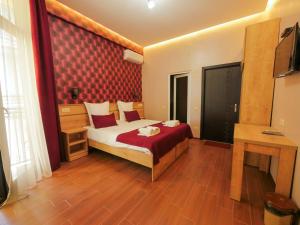 Postel nebo postele na pokoji v ubytování La'Rooms