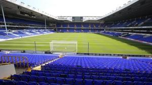 a stadium with blue seats and a soccer field at Wood Green direct tube Eurostar Heathrow, close Ally Pally in London