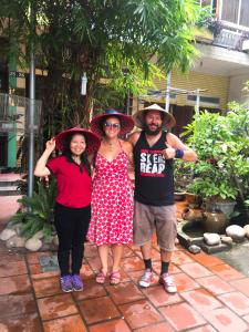 a group of people wearing hats posing for a picture at Halo Bay Homestay in Ha Long