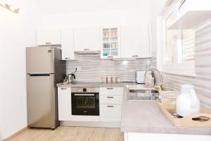 Kuchyň nebo kuchyňský kout v ubytování Apartment Nadoveza