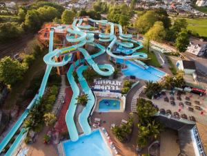 an aerial view of a water park with slides at Esplanade Court Apartment with communal seasonal heated pool in Paignton