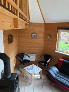 Posezení v ubytování Ostseebungalow-Peters