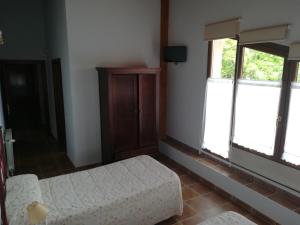 Łóżko lub łóżka w pokoju w obiekcie Casa Rural GAUBEKA