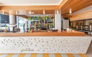 a restaurant with a food bar in a kitchen at Vanilla Garden Boutique Hotel - Adults Only in Playa de las Americas