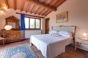 Letto o letti in una camera di Podere Vignola