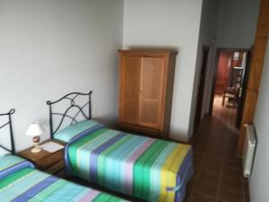 Łóżko lub łóżka w pokoju w obiekcie Casa Rural GAUBEKA