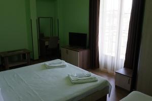 Postel nebo postele na pokoji v ubytování Villa Qero