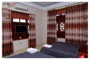 Postelja oz. postelje v sobi nastanitve An Binh Hotel