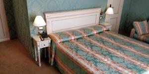 Postel nebo postele na pokoji v ubytování Hotel Villa Delle Palme