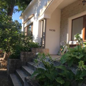 a house with stairs in front of it at Villa am Schwarzen Meer in Eforie Nord