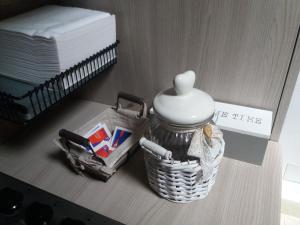 a table with a basket and a jar and a mattress at Mansarda Monte Bianco in La Salle