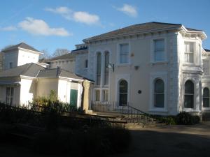 a white house with a group of buildings at Penmorvah in Penzance