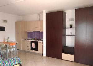 Kuchyň nebo kuchyňský kout v ubytování Residence Ilario Suite Hotel