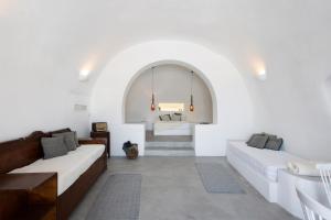 a white room with two beds and a sink at Villa Santorini 520 by Caldera Houses in Oia