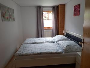 Llit o llits en una habitació de Ferienwohnung Langwallner