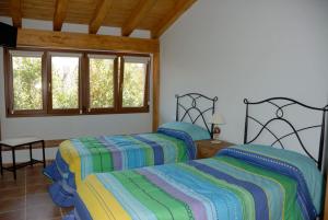 Łóżko lub łóżka w pokoju w obiekcie Casa Rural GAUBEKA