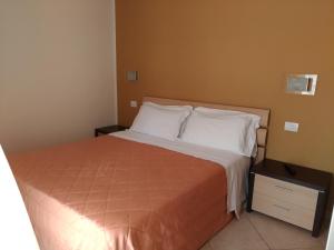 Postel nebo postele na pokoji v ubytování Residence Ilario Suite Hotel